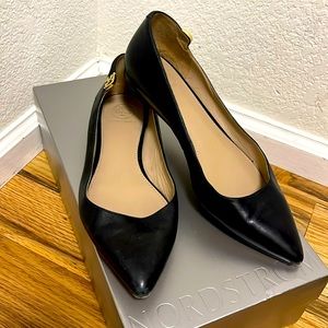 Black leather Tory Burch pointed toe flats with gold emblem on the side, size 7